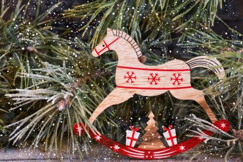 Christmas toy on a background of snow-covered fir branches